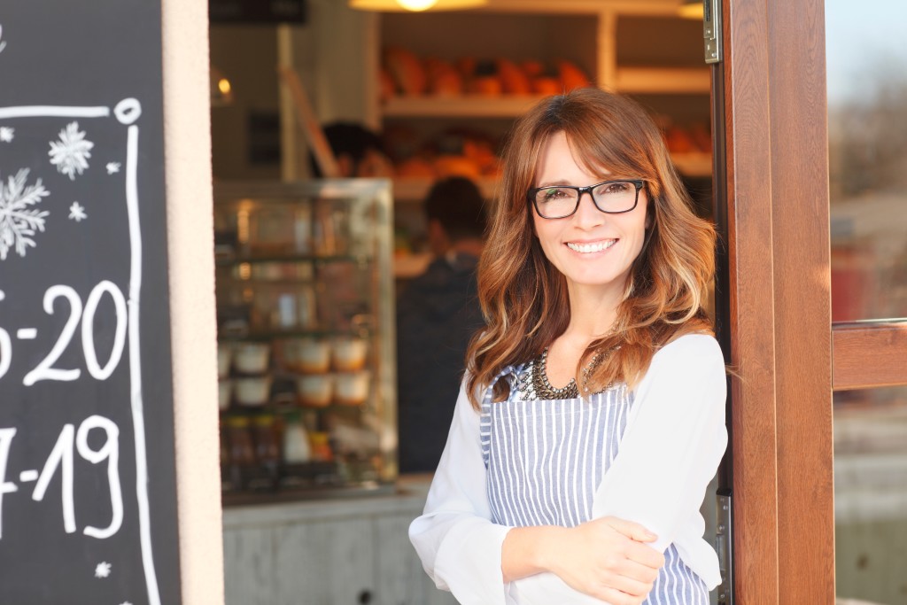 Woman standing in front of coffee shop